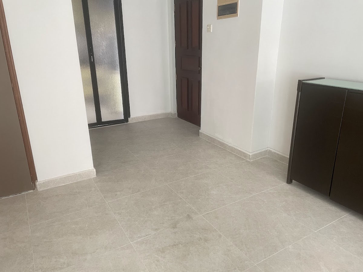 Finished beige floor tiling in a living area